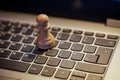 Chess paen on keyboard Royalty Free Stock Photo