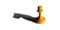 A chess pawn casting a knight piece shadow concept of strength Royalty Free Stock Photo