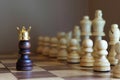 Chess pawn with golden crown confront the enemy team. Business leadership concept Royalty Free Stock Photo