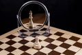 A chess pawn looks in the mirror and sees himself as a king