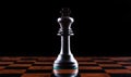 chess piece of a black king on a chessboard on a black background