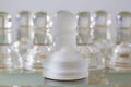 A chess piece in front of a group of others chess pieces. Business strategy and leadership concept Royalty Free Stock Photo