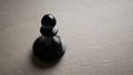 Chess piece Pawn close-up on a light background, the concept of an idea, promotion, success