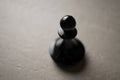Chess piece Pawn close-up on a light background, the concept of an idea, promotion, success