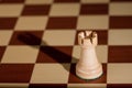 Chess piece - a white rook on a chessboard. Royalty Free Stock Photo