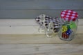 Chess pieces acrylic dice glass jar check pattern cloth wooden surface