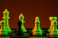 Chess pieces, Black pawn white pieces of silver on a chessboard, game. Concept of spy, espionage, confrontation, career, Royalty Free Stock Photo