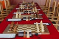 Chess pieces on a boart ready to play a game. Wood pieces of a game of chess on a board