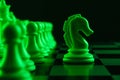 Chess pieces on a chessboard, knight move, game. The concept of confrontation, career, competition, startup Royalty Free Stock Photo