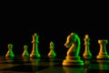 Chess pieces on a chessboard, knight move, game. The concept of confrontation, career, competition, startup