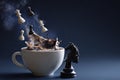 chess pieces falling into coffee cup still life Royalty Free Stock Photo