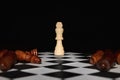 Chess pieces and game board on dark background Royalty Free Stock Photo