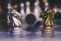 Chess pieces knights facing each other for a standoff. Chess knights confronting each other Royalty Free Stock Photo