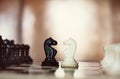 Chess pieces knights facing each other for a standoff Royalty Free Stock Photo