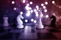 Chess pieces, queen, horse, king, white and black on a chessboard, concept of leadership and teamwork in business, duel,