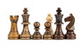 Chess pieces in a row, featuring both light and dark wood, isolated on white Royalty Free Stock Photo