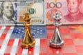 Chess pieces on USA and China national flag with banknote background Royalty Free Stock Photo
