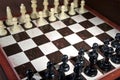 Chess pieces on wood board Royalty Free Stock Photo