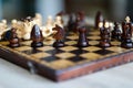 Chess pieces on wooden game board. Royalty Free Stock Photo
