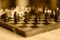 Chess pieces on wooden game board. Royalty Free Stock Photo