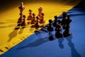 Chess pieces on the yellow blue flag of ukraine. The concept of russian Ukrainian war, escalation, military conflict Royalty Free Stock Photo