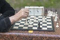 Chess player in the park. Old man plays chess in the park Royalty Free Stock Photo