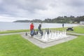 Chess players on oversized outdoor board and set