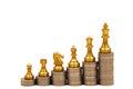 Chess stand on stack of coins. Business strategy and development concept. Pawn keeps growing until become king Royalty Free Stock Photo