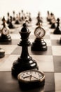 Chess strategy concept with black queen and clocks on board Royalty Free Stock Photo
