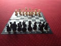 Chess table on red carpet