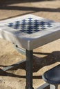 Chess table with seats in a public park Royalty Free Stock Photo