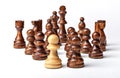 Chess. White pawn and Black figures on white background. Royalty Free Stock Photo