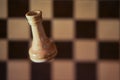 Chess white rook and chessboard, copy space background. Chess piece rook on the background of the cells of the chessboard Royalty Free Stock Photo