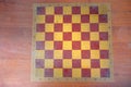 chessboard background texture yellow-brown with space for inscription