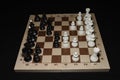 Chessboard with black chessmen as a skill backdrop Royalty Free Stock Photo