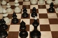 Chessboard with black chessmen for hobby backdrop Royalty Free Stock Photo