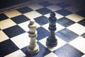 chessboard with the Black king and white queen facing in understanding concept