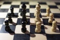 chessboard with Black Queen and white Queen in front in the concept of agreement with arounds pawns Royalty Free Stock Photo