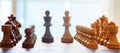 Chess board blurred with chess pieces on it. Close up view with details, white background. Royalty Free Stock Photo