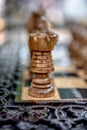 Chessboard with chess on a wooden bench.