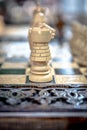 Chessboard with chess on a wooden bench.