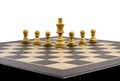 Chessboard with figures and leader, business leadership and perseverance concept Royalty Free Stock Photo