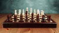 A chessboard made of wood with chess pieces placed on it stands on a table