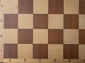 old chessboard made of wood Royalty Free Stock Photo