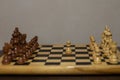 Chessboard with organized pieces and a single pawn