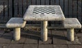 chessboard on a stone table in a public park (brooklyn new york city) chess board checkered squares Royalty Free Stock Photo