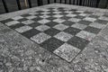 chessboard on a stone table in a public park (brooklyn new york city) chess board checkered squares Royalty Free Stock Photo