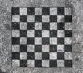 chessboard on a stone table in a public park (brooklyn new york city) chess board checkered squares Royalty Free Stock Photo