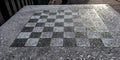 chessboard on a stone table in a public park (brooklyn new york city) chess board checkered squares Royalty Free Stock Photo