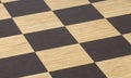 Chessboard texture with dark and light cells, selective focus, close-up